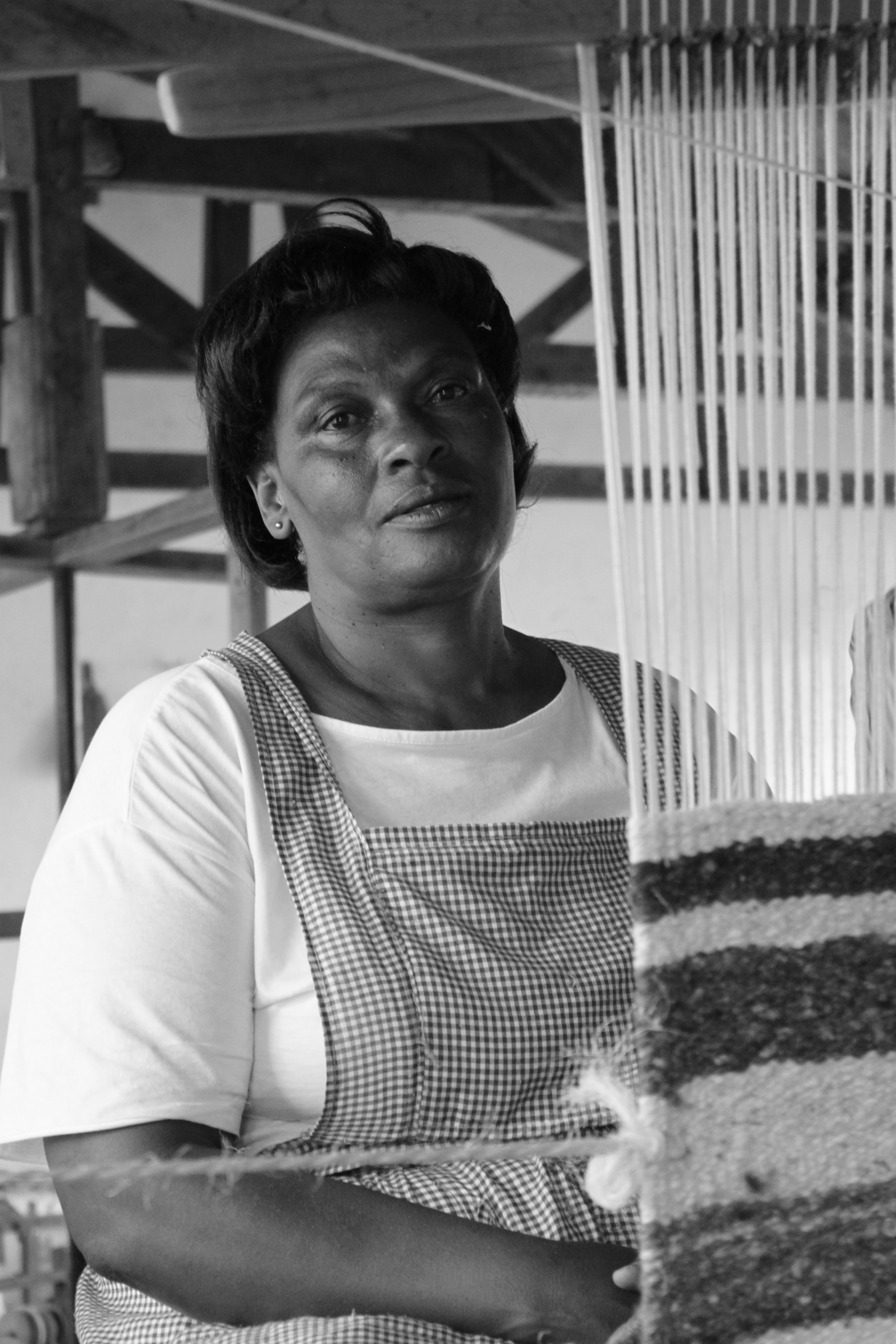 Weaver working at a traditional loom
